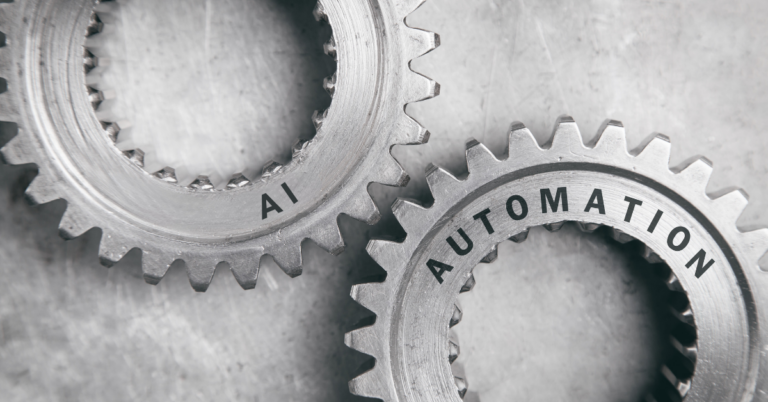 Close-up of two interlocking metal gears labeled 'AI' and 'Automation,' symbolizing the integration of artificial intelligence and automation in modern marketing strategies