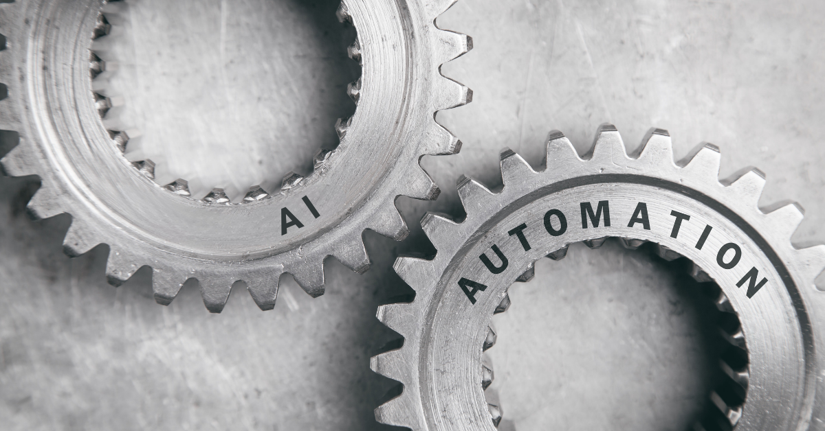 Close-up of two interlocking metal gears labeled 'AI' and 'Automation,' symbolizing the integration of artificial intelligence and automation in modern marketing strategies