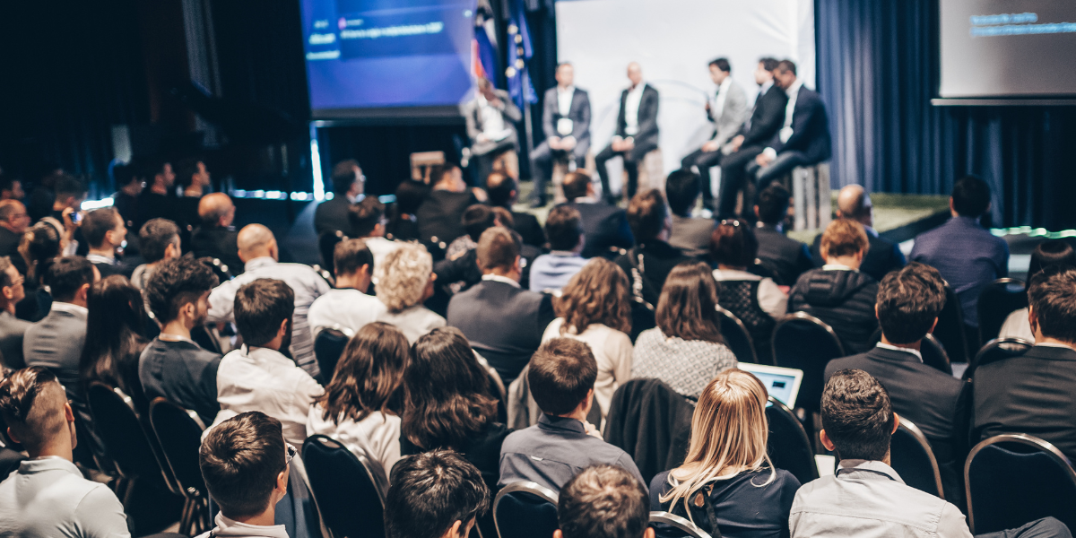 Audience watching a panel of speakers on stage at a professional conference, representing a creative session at Cannes Lions International Festival of Creativity 2025.