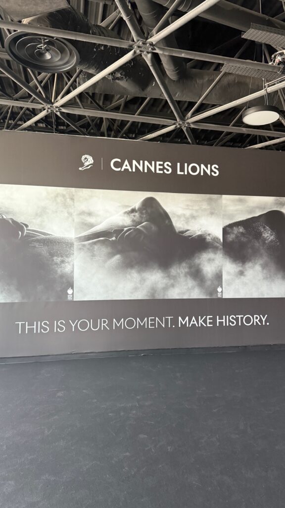 Cannes Lions 2025 wall display featuring black and white artwork with the message “This is your moment. Make history.”